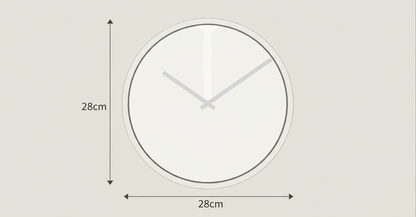 Minimalist wall clock with a white face and black rim on a light gray background